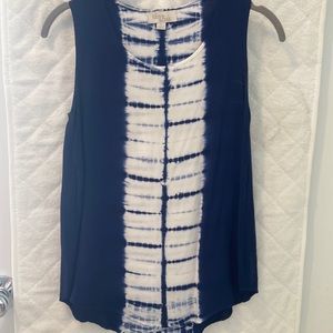 Blue and white sleeveless blouse